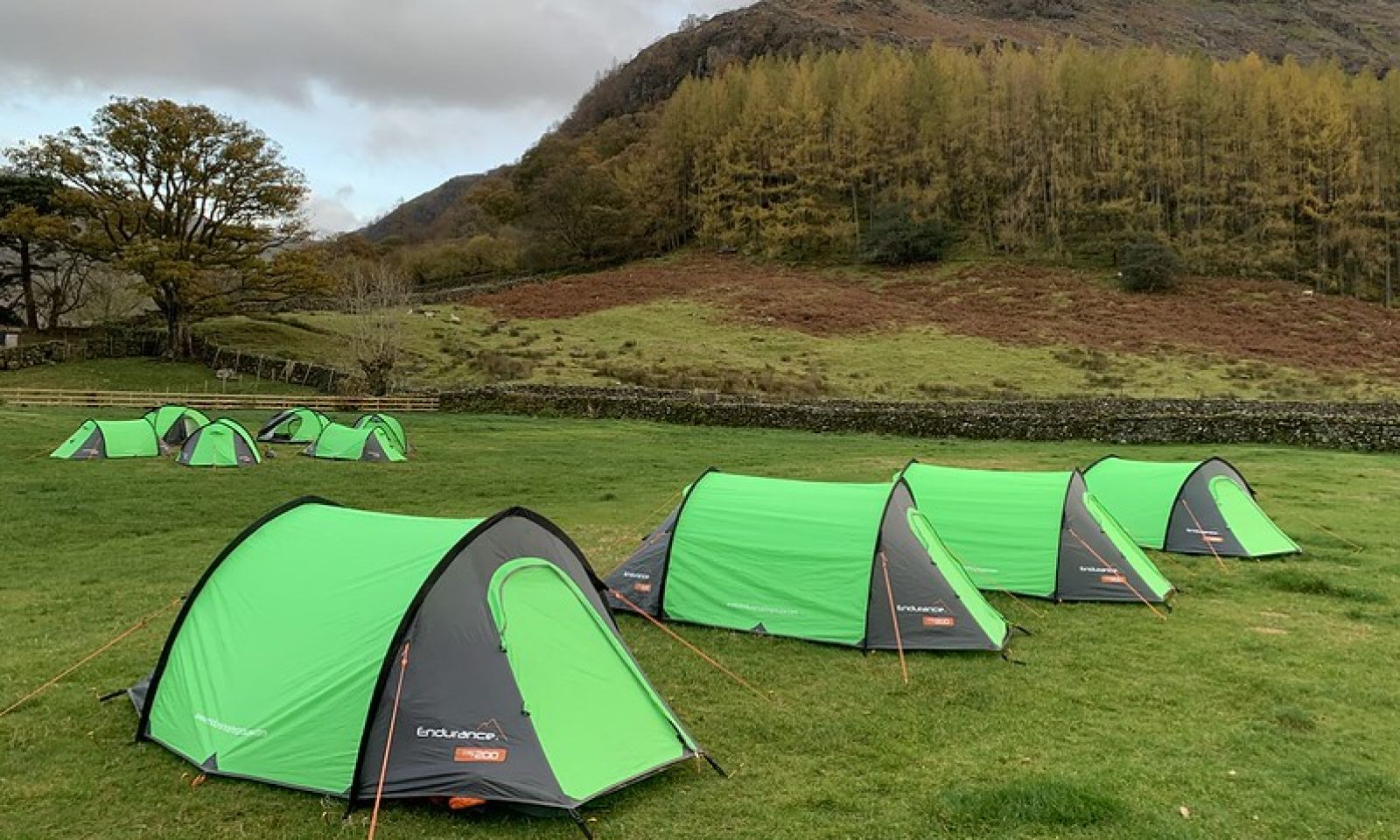 Duke of Edinburgh tents pitched at the bottom of a hill