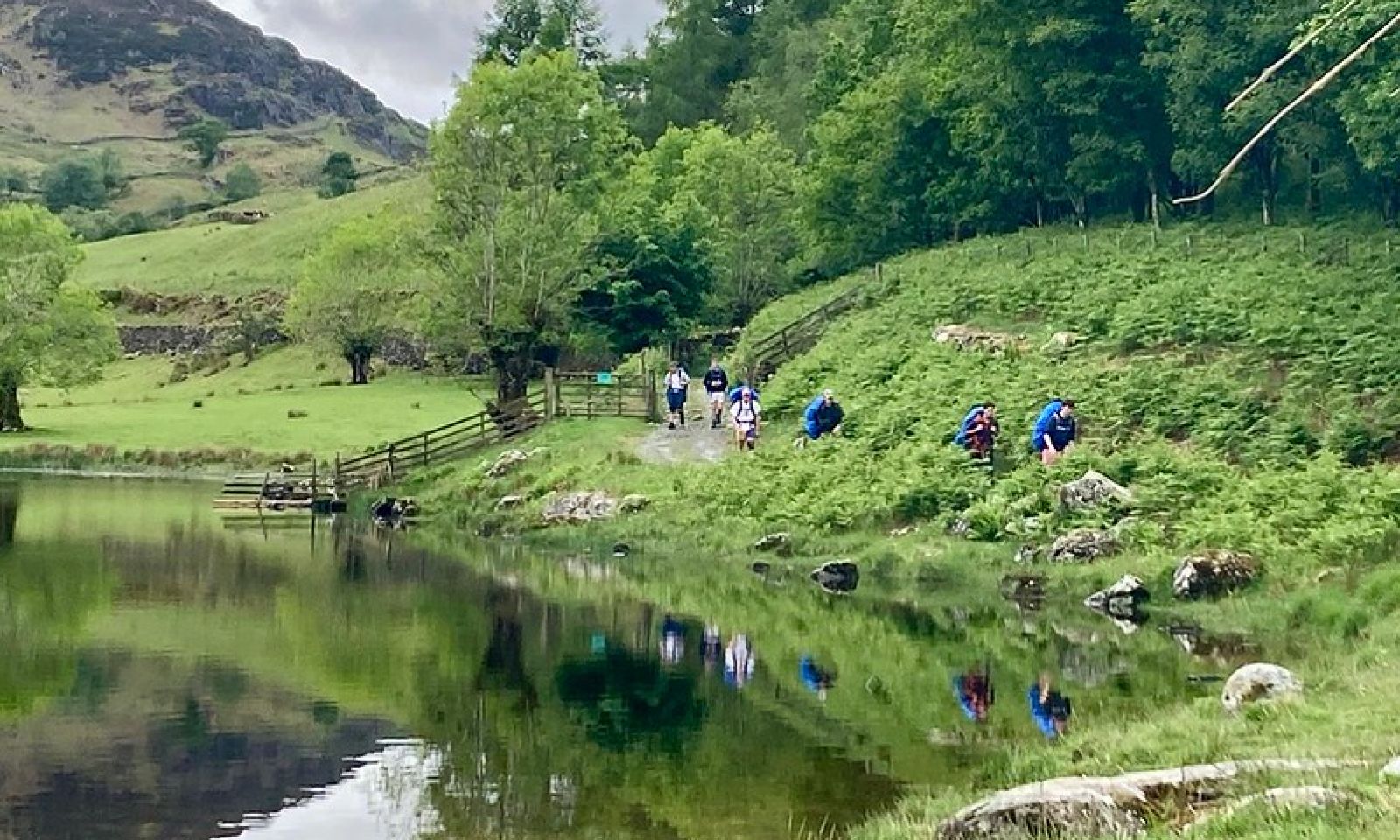 Walk by a tarn with young people