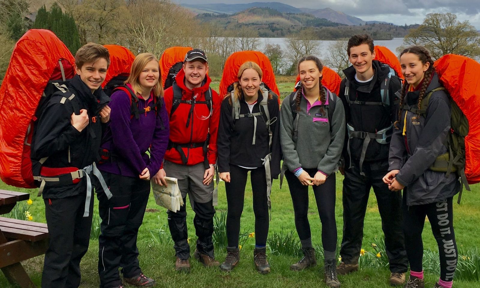7 DofE students on their expedition with fully packed rucksacks