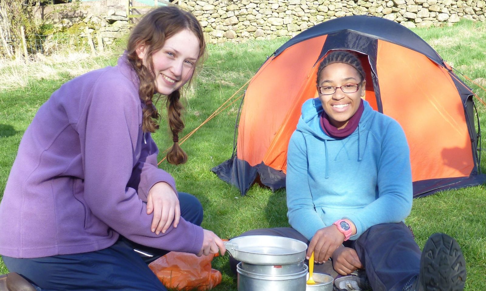 DofE expedition group working together as a team to look at the maps and work out the route