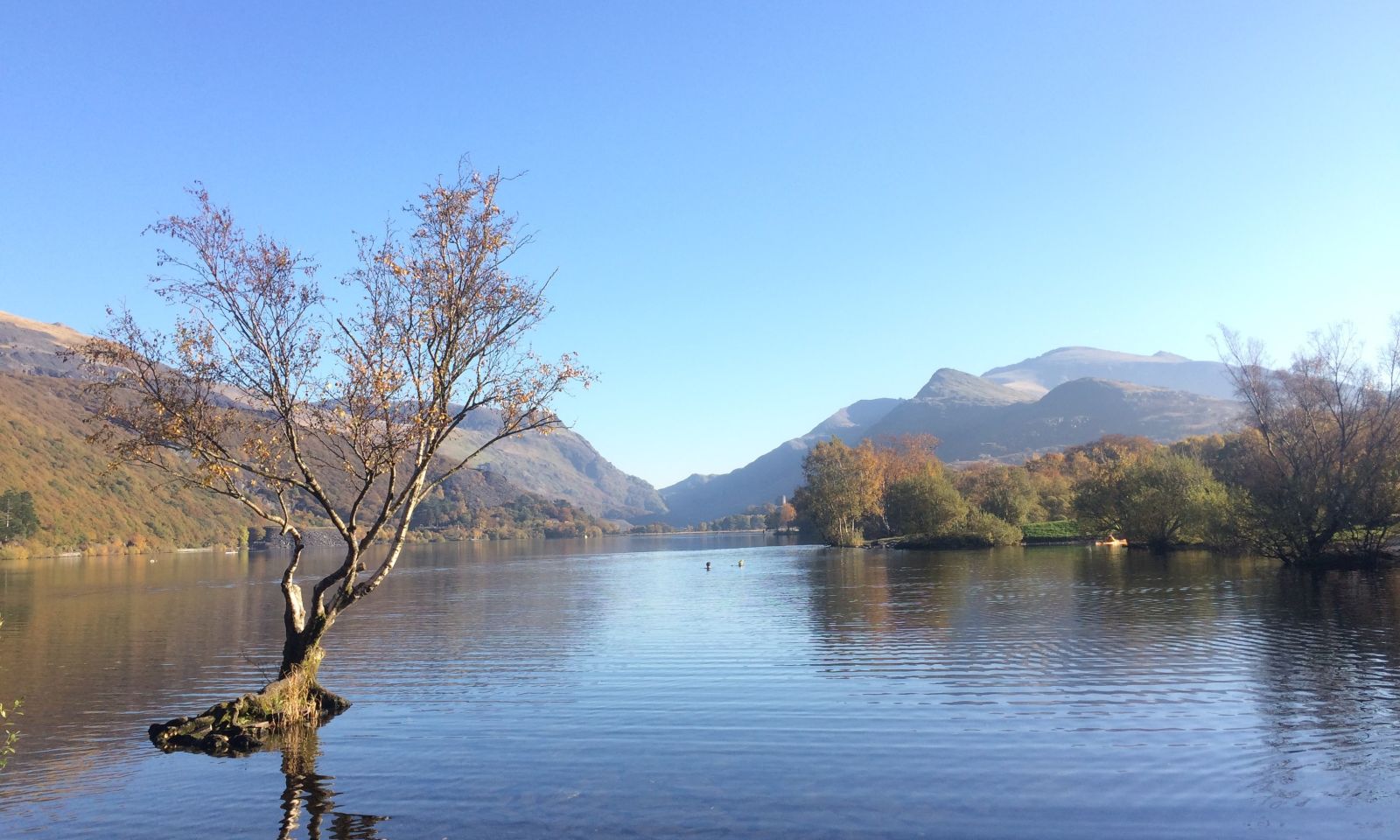 Mountains in the background with a large tarn in the foreground