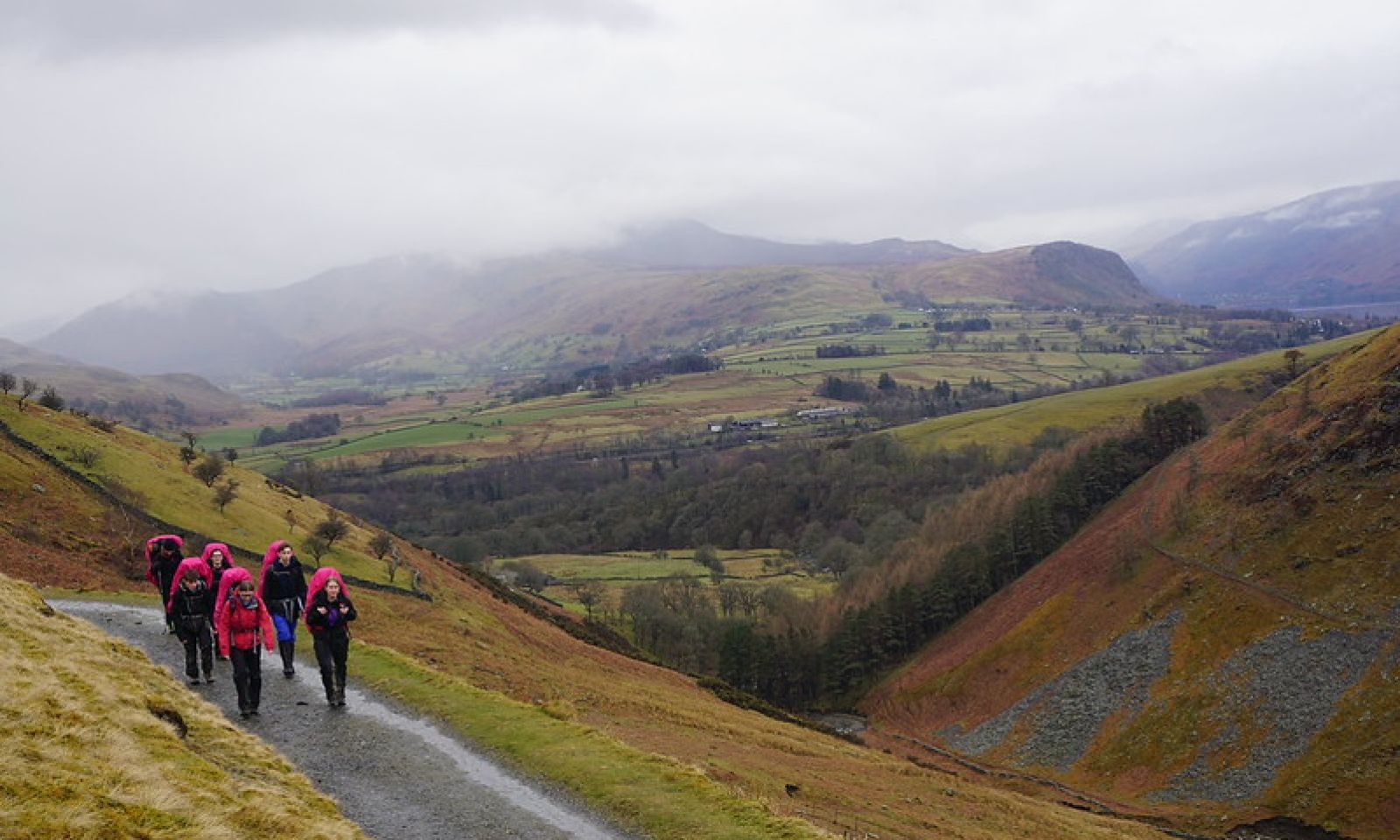 Young team of 6 students on their DofE expedition in cloudy weather
