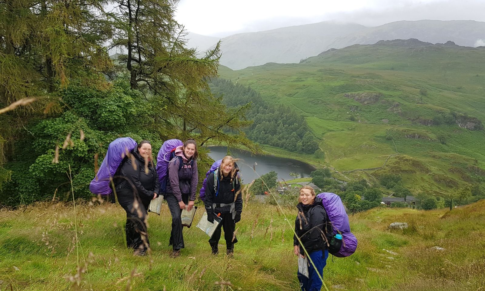 DofE group of 4 young people on expedition in the hills
