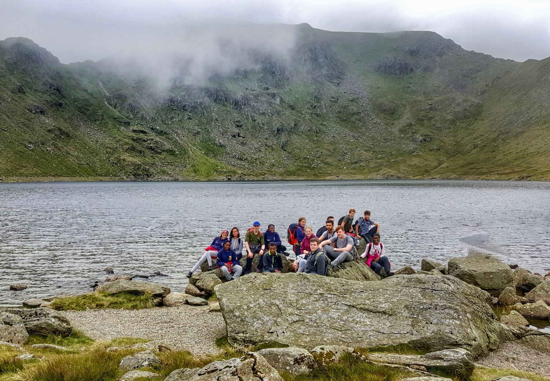 Enjoying the atmospheric Red Tarn in the shadow of Helvellyn.